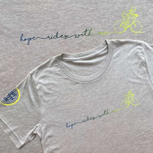 Gray t-shirt with 'hope rides with me' text and cycling graphics on a gray background